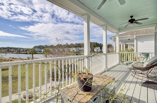 wooden terrace featuring a ceiling fan