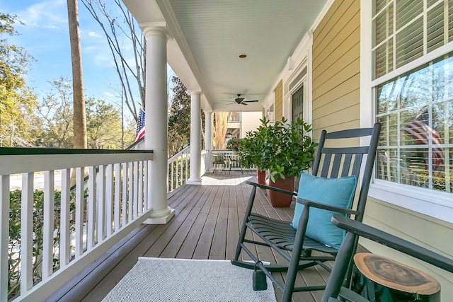 deck featuring a porch and ceiling fan