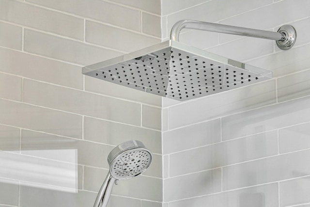 interior details featuring tiled shower