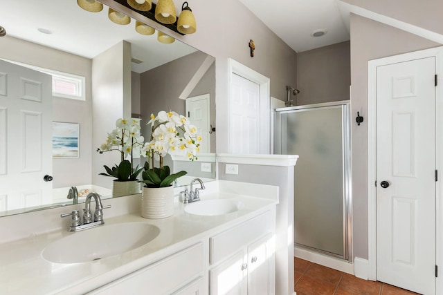 bathroom with vanity, tile patterned flooring, and walk in shower