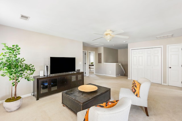 carpeted living room featuring electric panel and ceiling fan