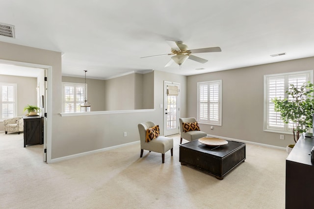 sitting room with light carpet and ceiling fan