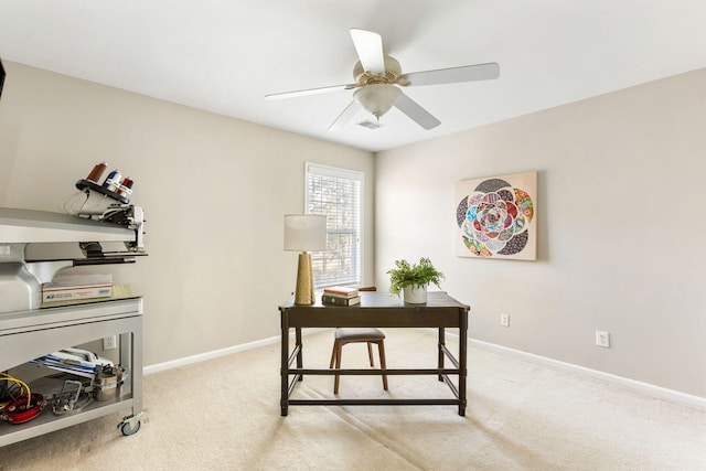 home office featuring ceiling fan and light colored carpet