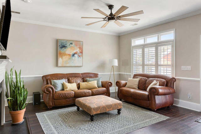 living room featuring ornamental molding, dark wood-type flooring, and ceiling fan