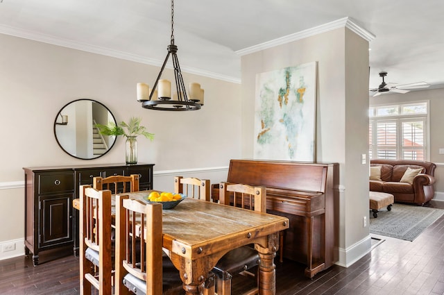 dining room with ceiling fan with notable chandelier, ornamental molding, and dark hardwood / wood-style floors