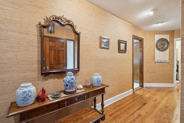528 Wampler Dr, Charleston, SC 29412 - corridor with a textured ceiling, baseboards, and light wood-style flooring