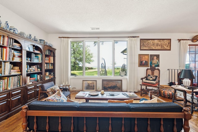 528 Wampler Dr, Charleston, SC 29412 - living area featuring wood finished floors and a textured ceiling