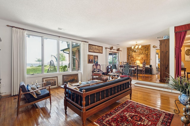 528 Wampler Dr, Charleston, SC 29412 - living area featuring a chandelier, hardwood / wood-style floors, a textured ceiling, and a fireplace