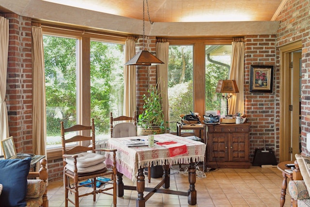 528 Wampler Dr, Charleston, SC 29412 - dining space featuring light tile patterned floors and brick wall