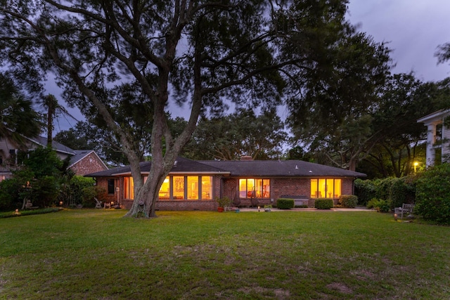 528 Wampler Dr, Charleston, SC 29412 - back of property at dusk with a lawn