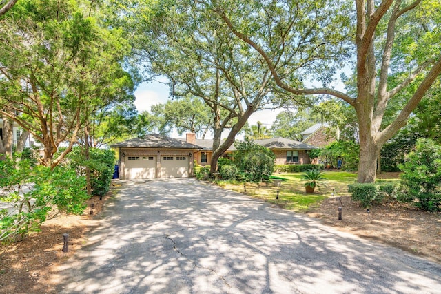528 Wampler Dr, Charleston, SC 29412 - view of front of property featuring asphalt driveway, an attached garage, and a chimney
