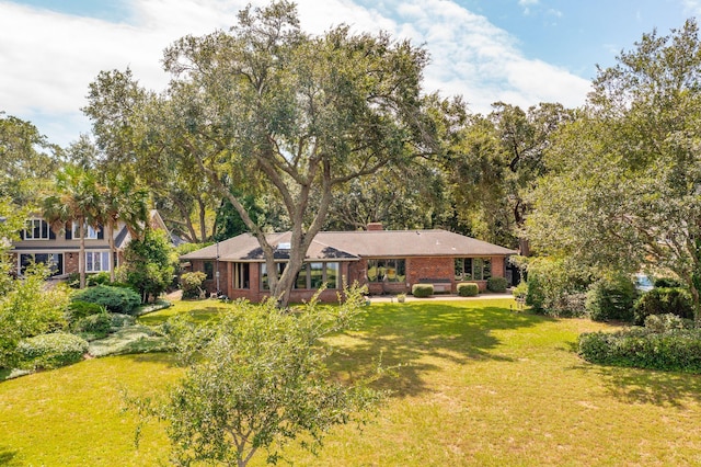 528 Wampler Dr, Charleston, SC 29412 - view of front of property with a front yard, brick siding, and a chimney