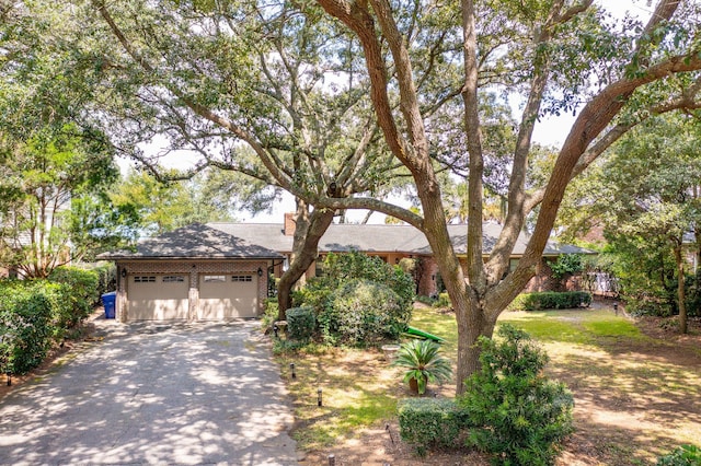 528 Wampler Dr, Charleston, SC 29412 - obstructed view of property with asphalt driveway and an attached garage