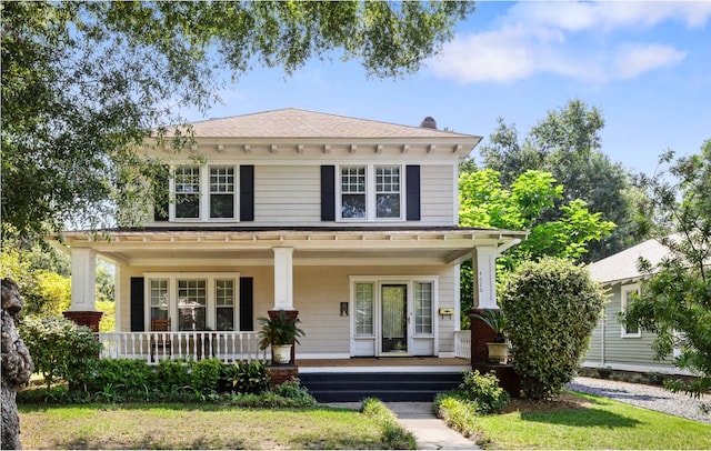 4626 Ohear Ave, North Charleston, SC 29405 - american foursquare style home featuring a porch and roof with shingles