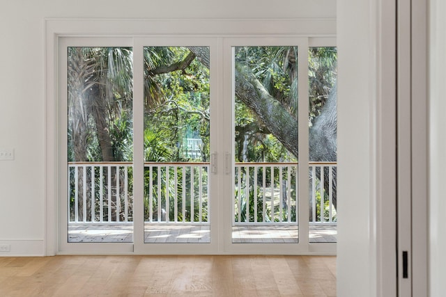 entryway with a healthy amount of sunlight and wood finished floors