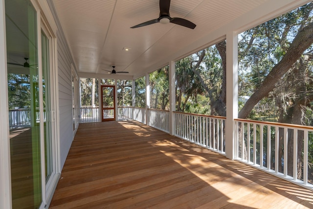 wooden deck featuring ceiling fan