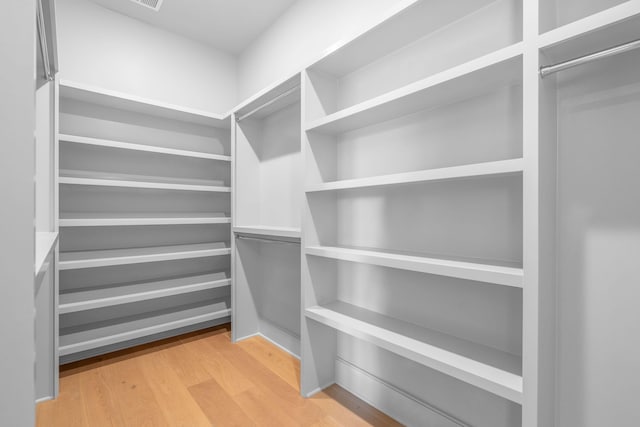 spacious closet with light wood-style flooring