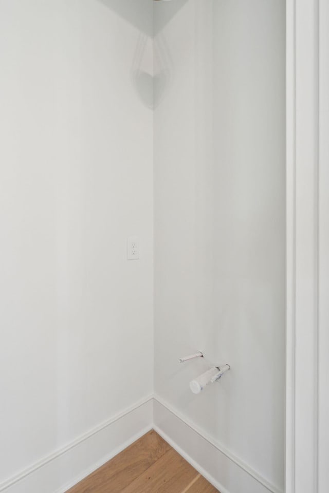 interior space featuring light wood finished floors and baseboards