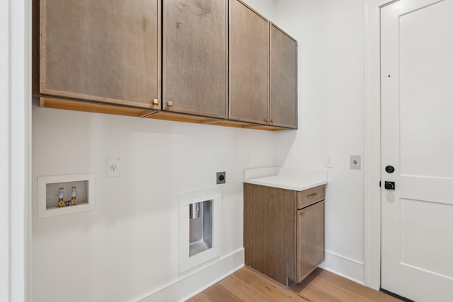 laundry room featuring light wood-style flooring, washer hookup, baseboards, cabinet space, and electric dryer hookup