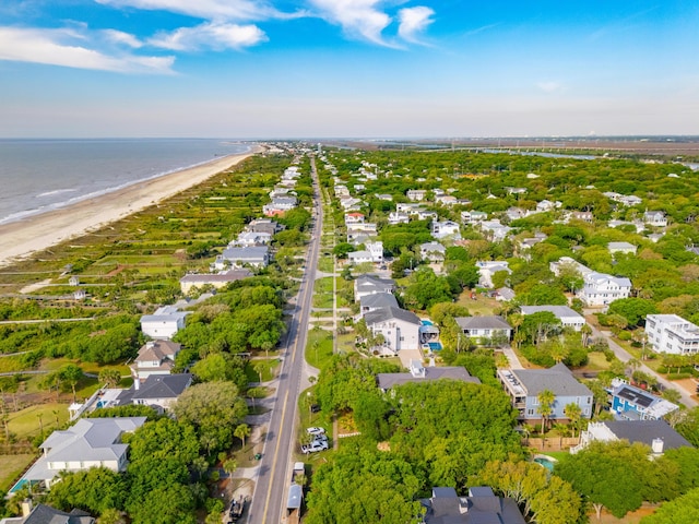 drone / aerial view with a water view, a residential view, and a view of the beach