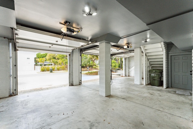 garage featuring ceiling fan and a garage door opener