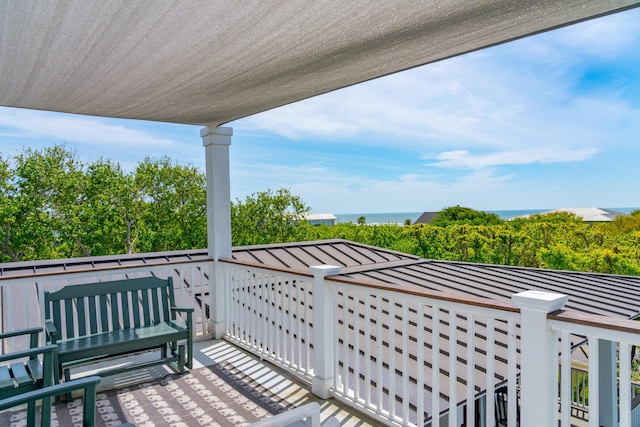balcony featuring a water view