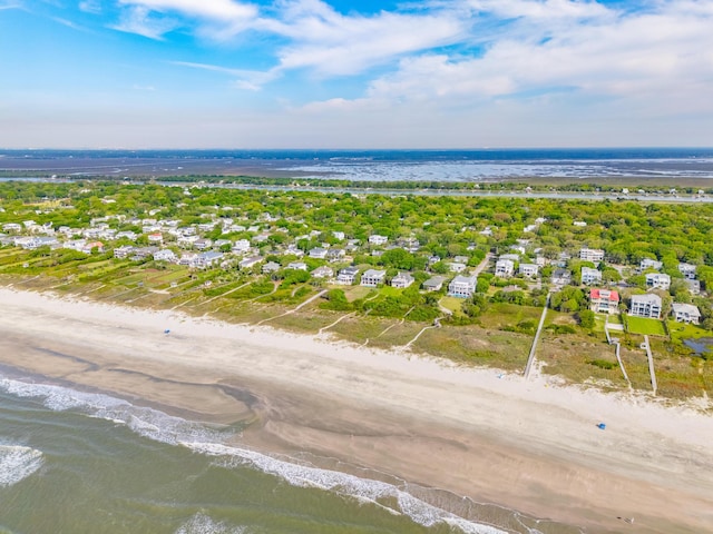 bird's eye view with a water view, a residential view, and a beach view