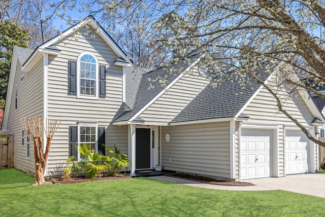 traditional-style home featuring a garage, a front lawn, roof with shingles, and driveway