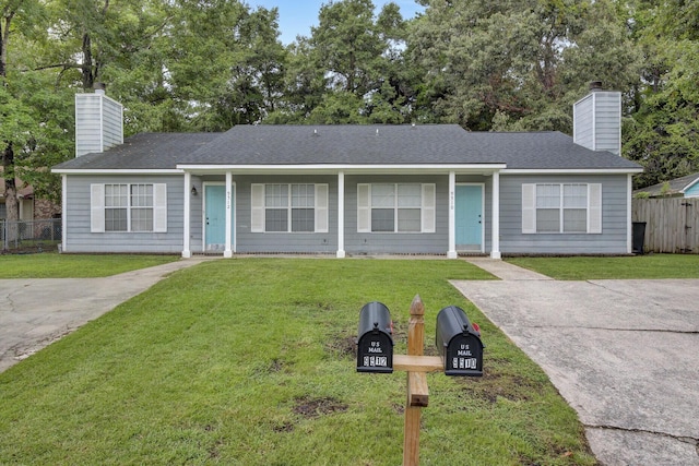 ranch-style house featuring a front lawn