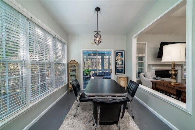 dining area with tile patterned flooring and baseboards