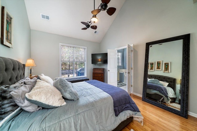 bedroom with visible vents, light wood-type flooring, and baseboards