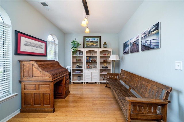 living area featuring visible vents and light wood-type flooring