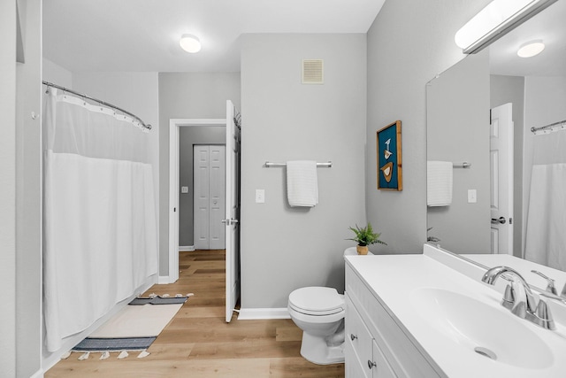 60 Fenwick Hall Aly Unit 415, Johns Island, SC 29455 - full bathroom with vanity, toilet, wood finished floors, baseboards, and a shower with curtain