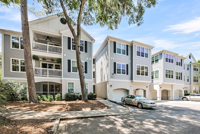 60 Fenwick Hall Aly Unit 415, Johns Island, SC 29455 - view of building exterior with asphalt driveway and an attached garage