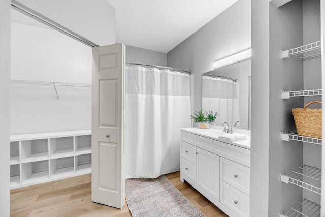 60 Fenwick Hall Aly Unit 415, Johns Island, SC 29455 - full bath with wood finished floors, vanity, a shower with curtain, and a spacious closet