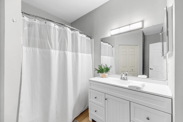 60 Fenwick Hall Aly Unit 415, Johns Island, SC 29455 - full bath featuring vanity, wood finished floors, and a shower with curtain