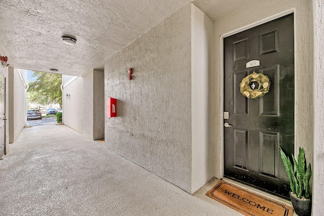 60 Fenwick Hall Aly Unit 415, Johns Island, SC 29455 - doorway to property with stucco siding