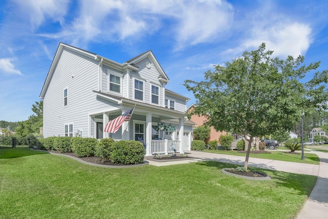 view of front of house with a porch, driveway, a front lawn, and a garage