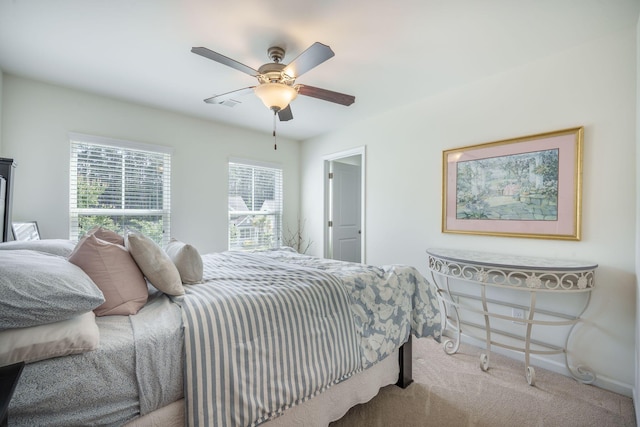 bedroom featuring carpet flooring, a ceiling fan, and baseboards