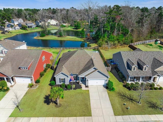 drone / aerial view with a residential view and a water view