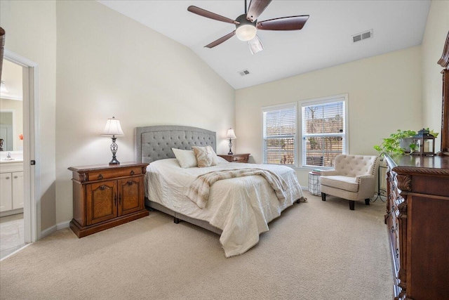 bedroom featuring lofted ceiling, visible vents, and light colored carpet