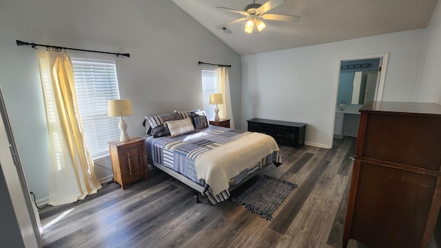 bedroom with ceiling fan, dark hardwood / wood-style flooring, ensuite bath, and vaulted ceiling