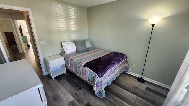 bedroom featuring dark wood-type flooring