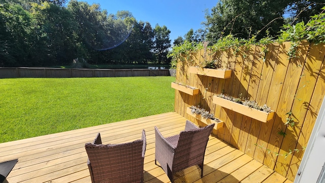 wooden terrace with a yard