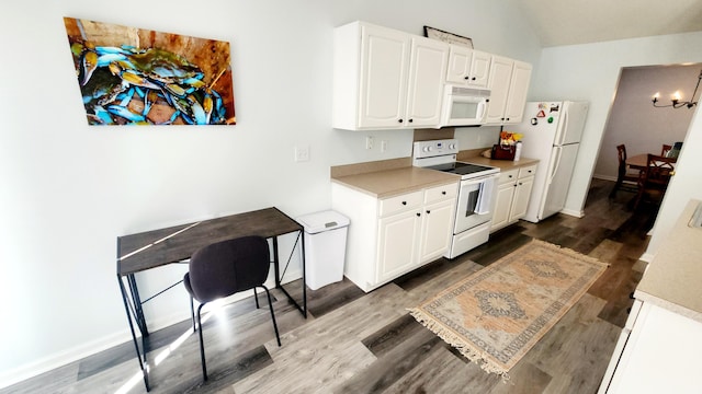 kitchen featuring a notable chandelier, white cabinetry, white appliances, and dark wood-type flooring