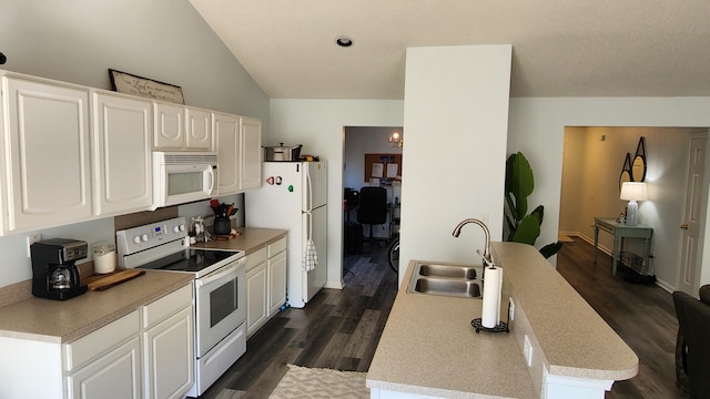 kitchen featuring white appliances, lofted ceiling, sink, dark hardwood / wood-style floors, and white cabinetry