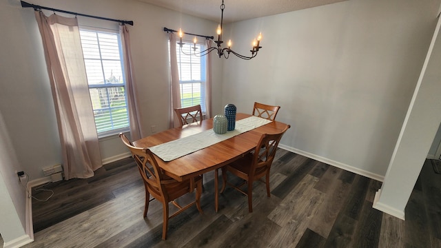 dining room featuring dark hardwood / wood-style flooring and a notable chandelier