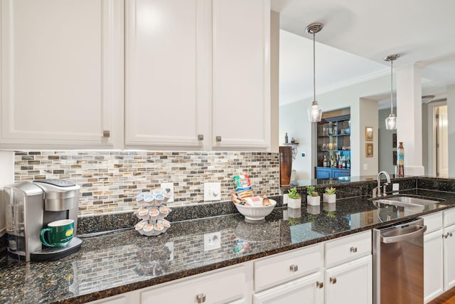 kitchen with tasteful backsplash, stainless steel dishwasher, a sink, and white cabinets