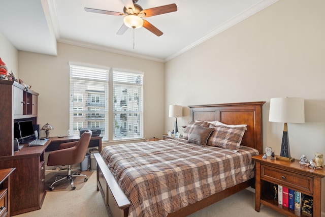 bedroom featuring crown molding, ceiling fan, and light colored carpet