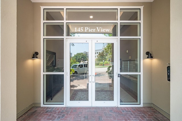 doorway to property with french doors and stucco siding